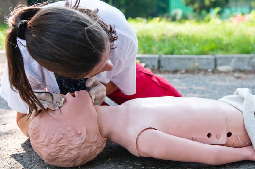 Paramedic with CPR dummy